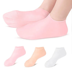 Set of three pairs of pink, peach, and white socks on a white background