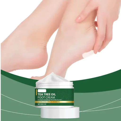 Tea tree oil foot cream with a hand applying it to the foot on a green background