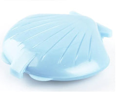 Blue silicone mold shaped like a shell on a white background