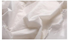 Close-up of white fabric with a textured pattern