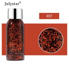 Bottle of glitter with a close-up detail on a white background, featuring the brand 'Julystar'.