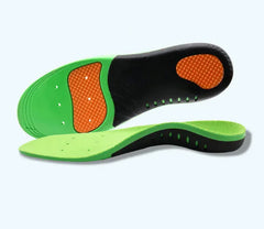 Green and black shoe insoles with orange accents on a light gray background