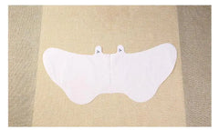 White feet sleeves spread out on a beige fabric background