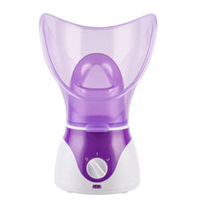 Purple facial steamer on a white background