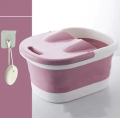 Pink and white foot bath bucket with a white background
