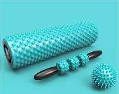 Turquoise massage roller with black handle on a blue background