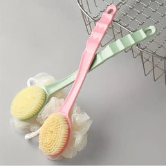 Two bath brushes, one pink and one green, with a yellow bristle head, hanging on a wire rack.
