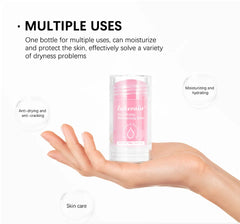 Hand holding a pink skincare product with text about multiple uses on a white background