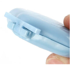 Light blue device holder held by a hand on a white background