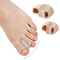 Beige toe correctors on a foot with additional correctors on a white background