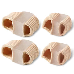 Four beige elastic toe covers on a white background