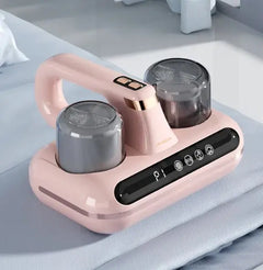Pink electric mattress vacuum with two transparent containers on a light gray surface