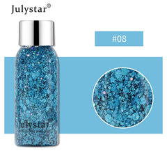 Bottle of blue glitter with Julystar branding on a white background