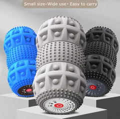 Three textured massage balls in blue, gray, and black on a light gray background.