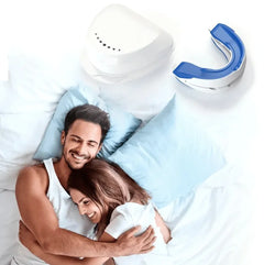 Couple in bed with mouth guard box and mouth guard shown on a white background.