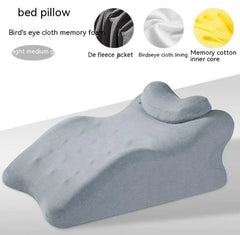 Gray bed pillow with detailed material components on a white background