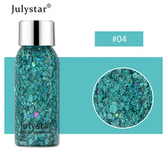 Julystar glitter bottle with close-up of glitter on a teal background