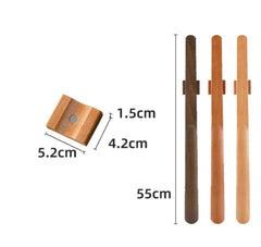 Wooden shoehorns on magnetic holders with measurements against a white background