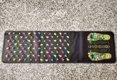 Colorful patterned mat on a speckled surface