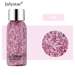 Pink glitter bottle with silver cap on a pink background, featuring the brand 'Julystar'.