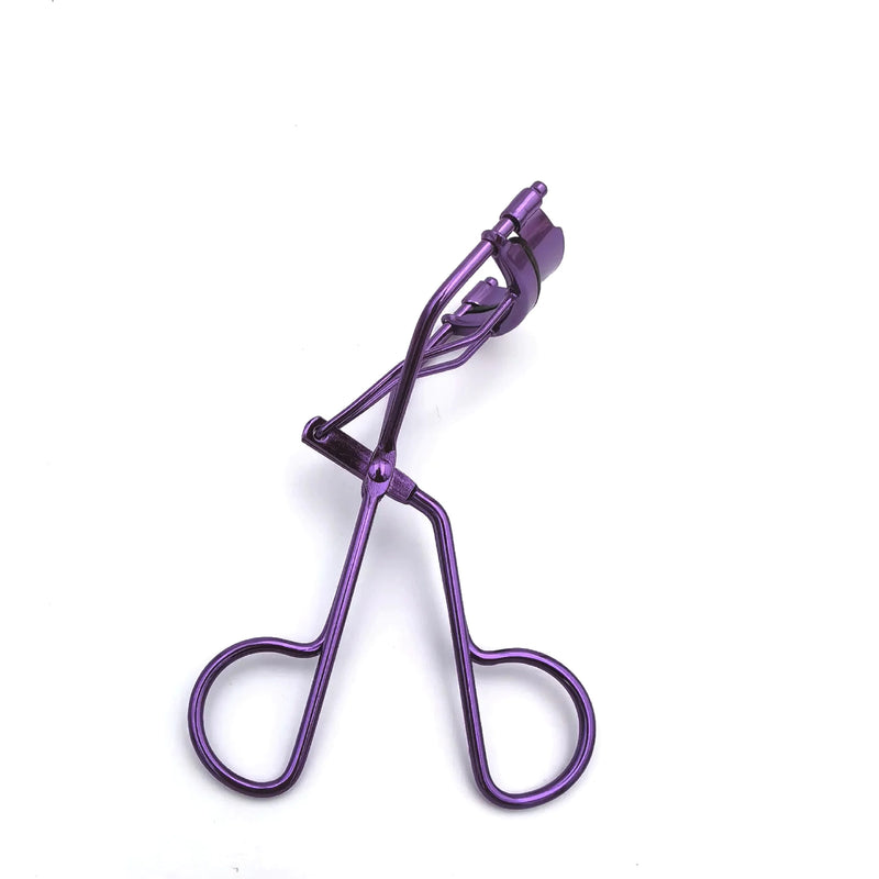 Purple eyelash curler on a white background