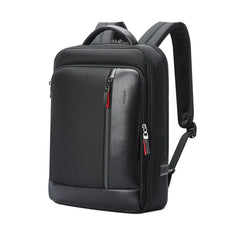 Black backpack with multiple zippers on a white background