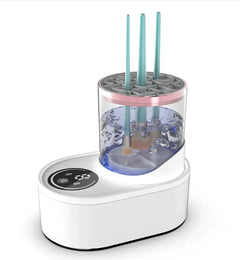 White electronic cleaner with a clear container holding makeup brushes on a white background