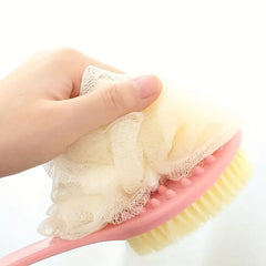 Hand holding a pink bath brush with a close-up of the bristle head and loofah on a white background