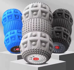 Three massage balls in blue, gray, and black on a white background