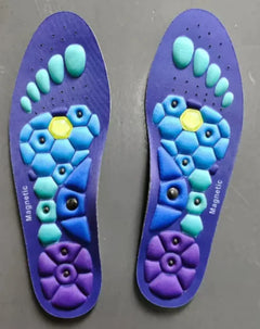 Pair of blue and purple shoe insoles with floral designs on a gray background