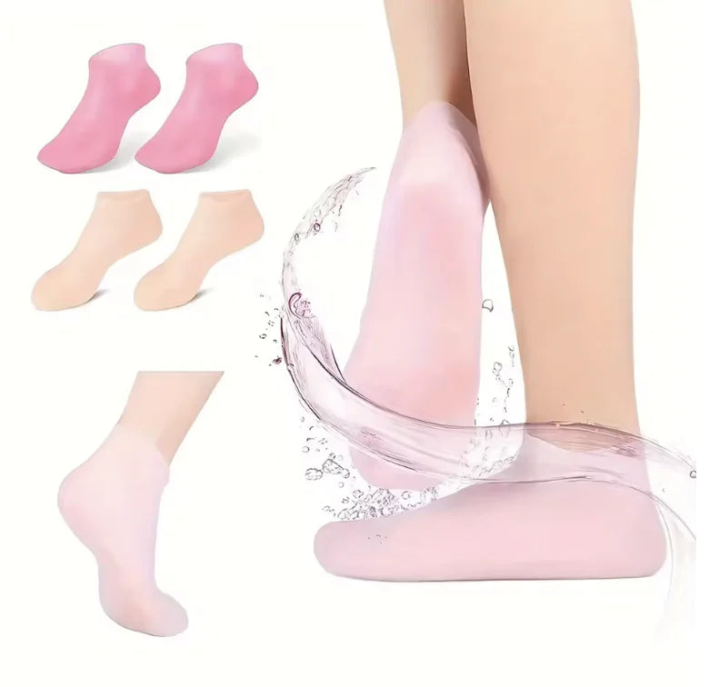 Pink socks being worn with a splash of water, on a white background