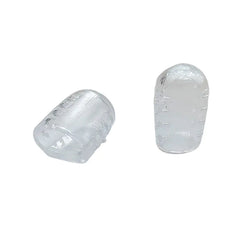 Two clear plastic toe protectors on a white background
