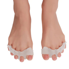 White toe separators on feet against a white background